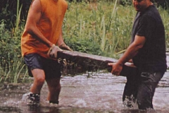 Carrying headstone from river 2001